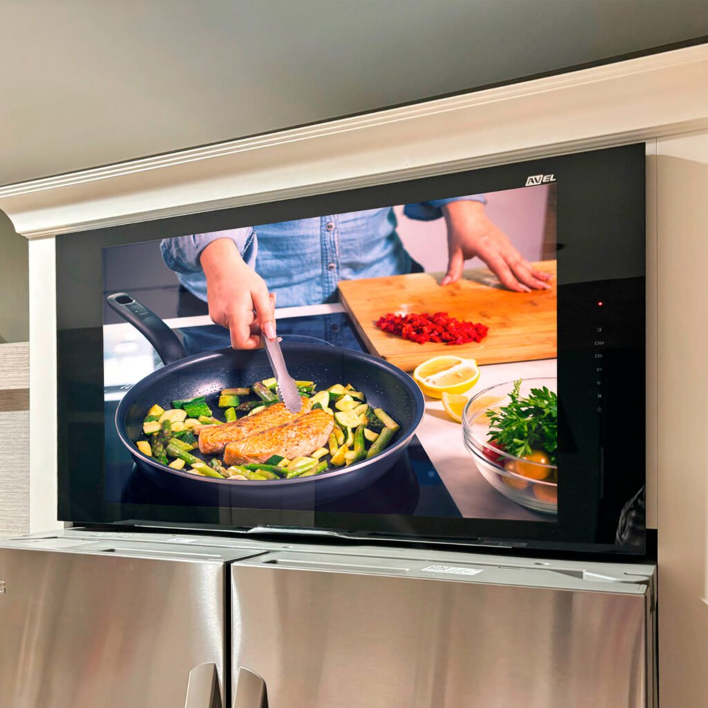 kitchen tv installed above a refrigerator