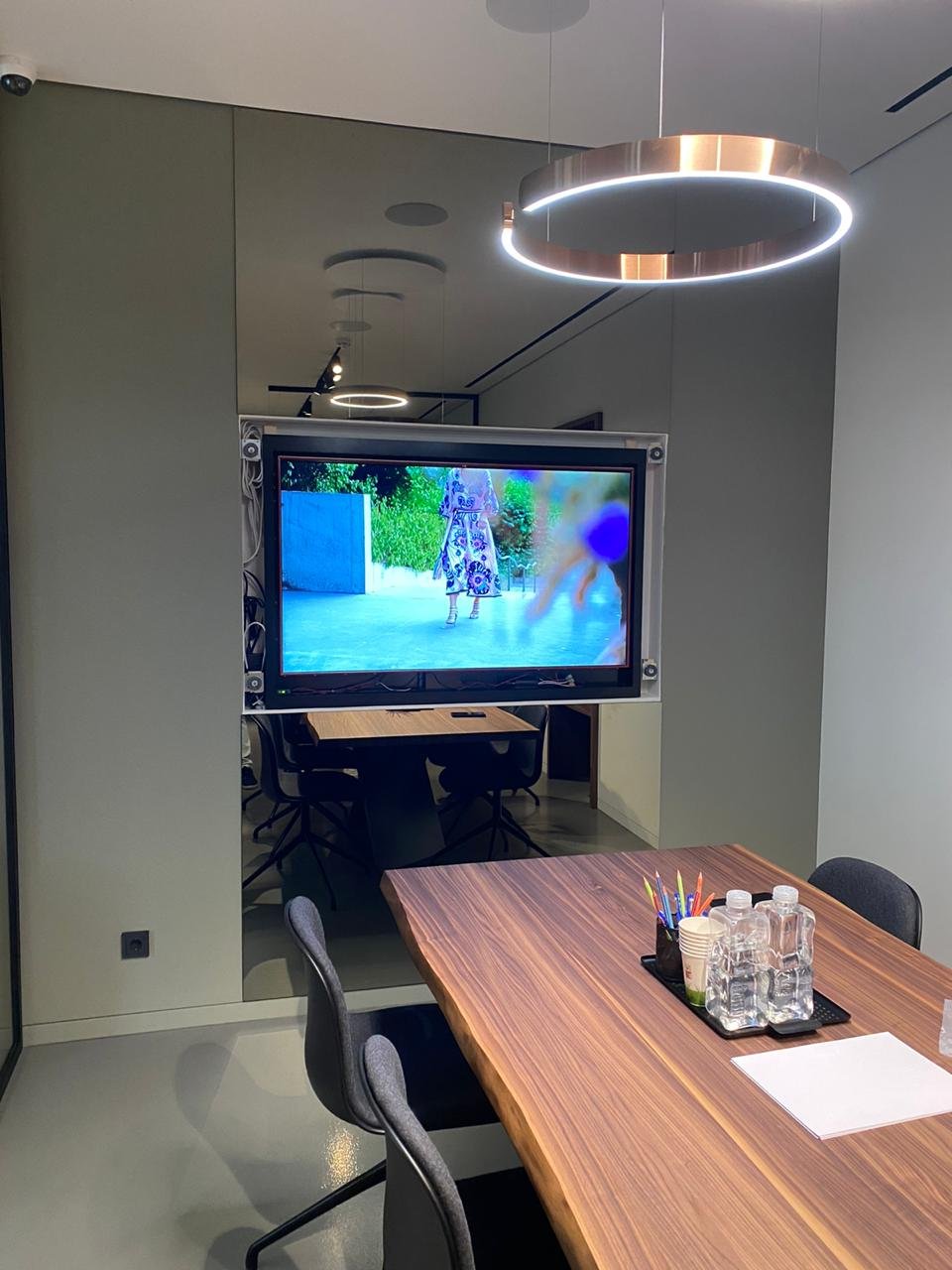 A custom magic mirror TV is a surprisingly dynamic addition to a conference room